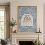 Living room with a fireplace, framed artwork, and decorative elements.