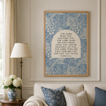 Living room with a sofa, decorative pillows, and a framed artwork on the wall.