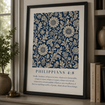 Framed floral pattern with 'Philippians 4:8' text on a shelf.