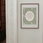 Framed artwork on a wall with decorative molding
