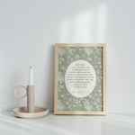Framed artwork with a candle on a white surface
