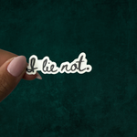 A black and white sticker that says "i Lie not" - a quote from the Unselected Journals of Emma M. Lion