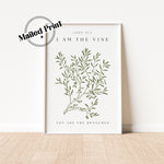 A white framed print with a green vine illustration and the text &#39;JOHN 15:5&#39;, &#39;I AM THE VINE&#39;, and &#39;YOU ARE THE BRANCHES&#39;.