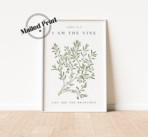 A white framed print with a green vine illustration and the text &#39;JOHN 15:5&#39;, &#39;I AM THE VINE&#39;, and &#39;YOU ARE THE BRANCHES&#39;.