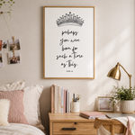 A framed wall art print with a black crown illustration and the quote 'Perhaps you were born for such a time as this. Esther 4:14' hangs above a wooden bedside table in a softly styled bedroom.