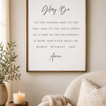 A framed wall art print featuring the Bible verse 'Glorify Be to the Father and to the Son, and to the Holy Spirit.
