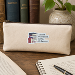 A beige canvas zip pouch with a printed book sticker reading 'I cannot live without books. - The Judgeven.